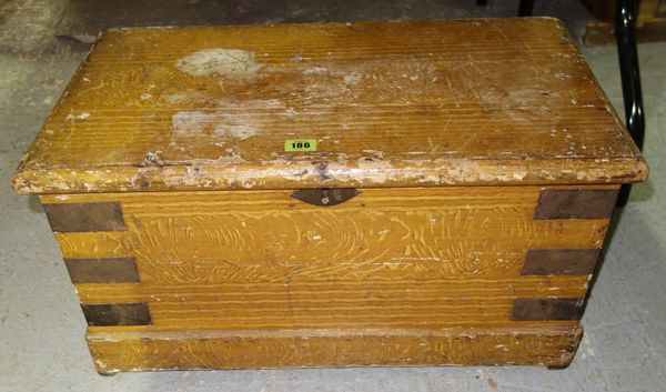 A Victorian scumbled pine box, with hinged lid and metal straps, 61cm wide.