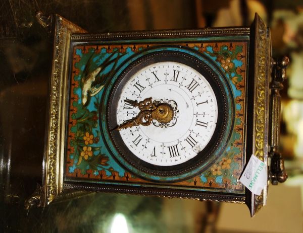 A gilt metal and enamel cased chinoiserie decorated mantel clock.