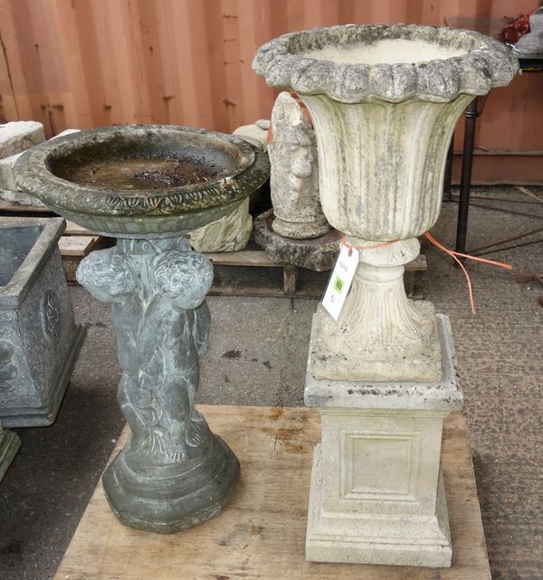 A flued reconstituted stone campana urn on stand together with a decorative birdbath. (4)