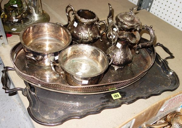 A group of silver plated wares, comprising; a shaped rectangular two handled tray, an oval galleried tray, a Victorian three piece tea set and two cir