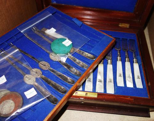 An incomplete set of silver plated dessert knives and forks, with mother of pearl handles and engraved family crest, together with five plated lobster