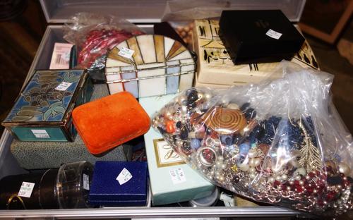A large quantity of assorted costume jewellery and silver plate.