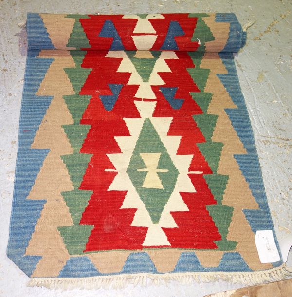 A 20th century Kilim runner with blue, red and cream, 246cm x 82cm.