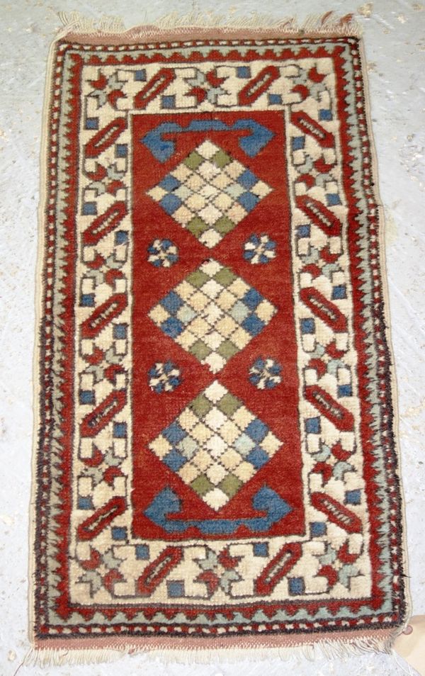 A 20th century Persian mat, 97cm x 52cm.