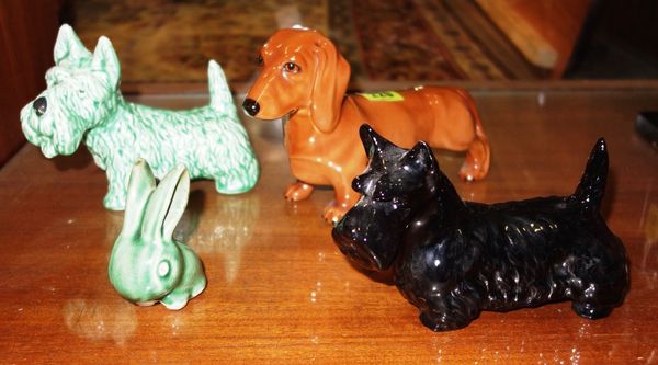 A Beswick model of a dachshund, a Sylvac dachshund, a Beswick Scotty dog and a Sylvac rabbit. (4)