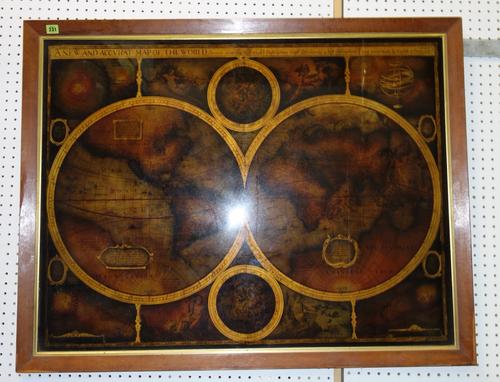 A framed print of 'The New Map of the World'.
