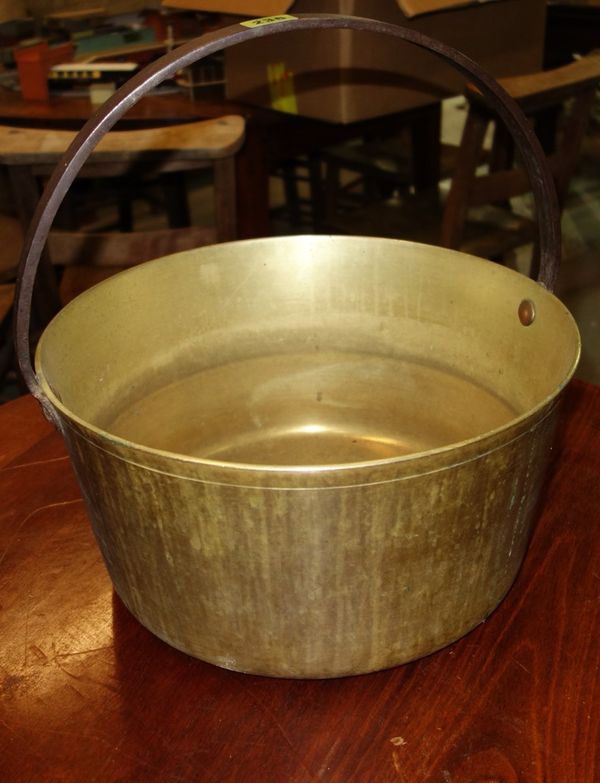 A 19th century brass jam pan with iron loop handle, 40cm wide.