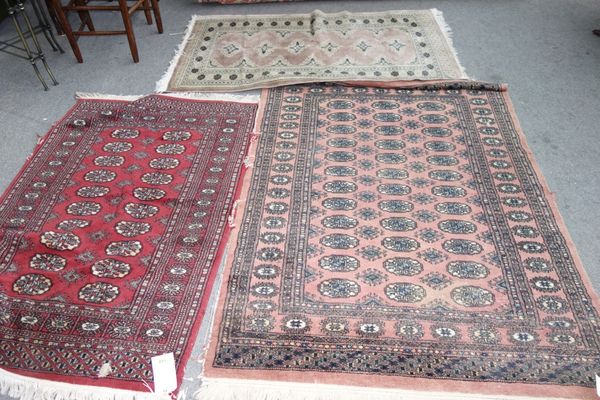 Three Pakistan Bokhara rugs. (3)