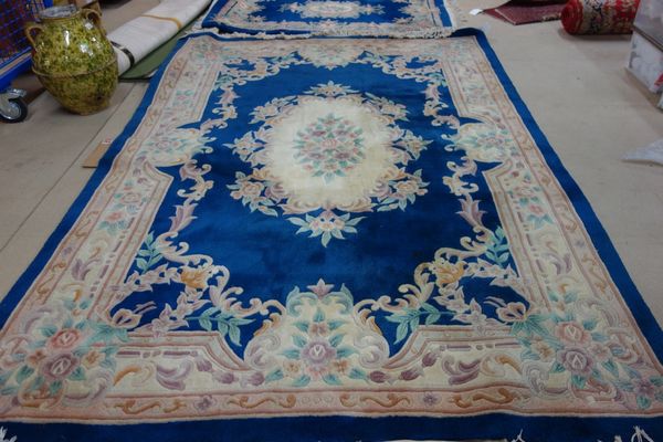 A hooked Chinese carpet, indigo field, 310cm x 213cm.