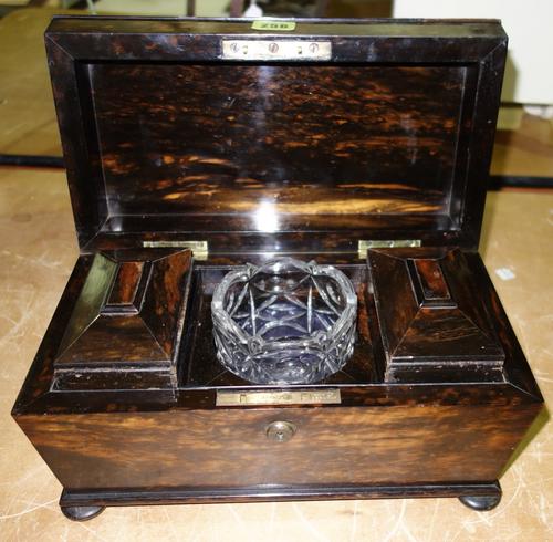 A Regency coromandel tea caddy of sarcophagus form, the Bramah lock plate stamped 'J.T. Needs 100 New Bond Street' with two canisters and glass bowl,