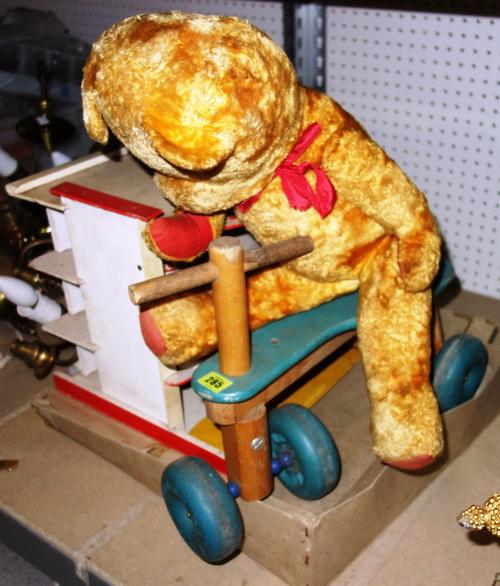 A table top billiards game, a scratch built toy garage and sundry toys and a group of toy fishing rods. (qty)