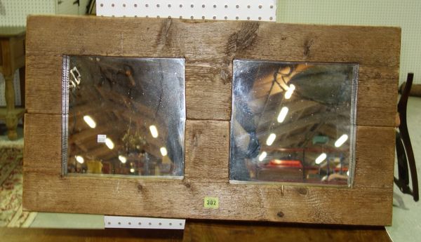 A stained pine rustic two plate wall mirror, 82.5cm wide