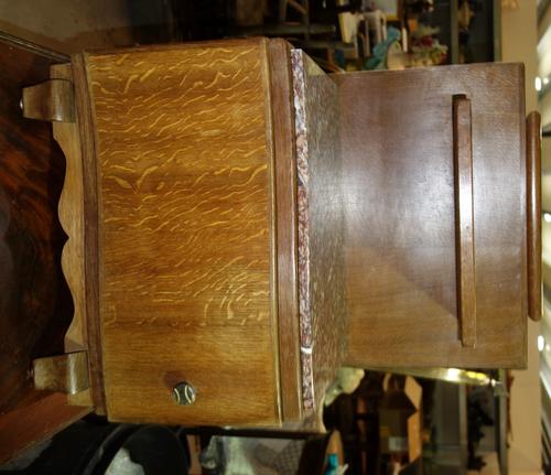 A pair of oak and marble topped bedside cabinets 51.5 cm cm wide. (2)