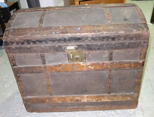 A wood and iron bound canvas trunk, 19th century, with domed hinged top, studded initials 'AG', leather handles and a lift-out tray, 70cm long.