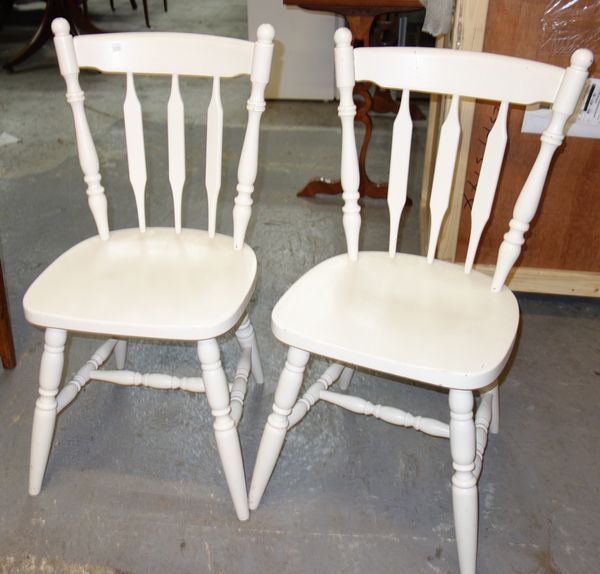 A set of four 20th century white painted pine dining chairs. (4)