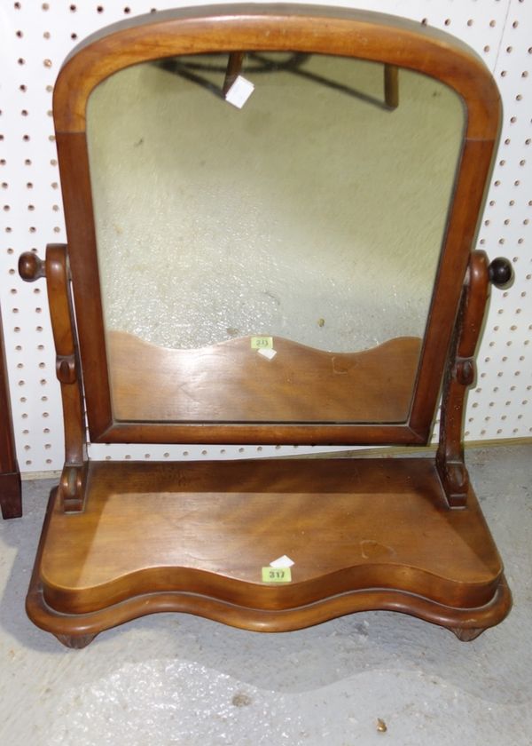 A Victorian mahogany arch top swing frame mirror with serpentine base, 58cm wide.