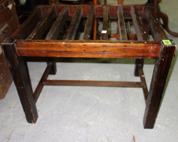 An early 20th century oak luggage stand, 60cm wide.