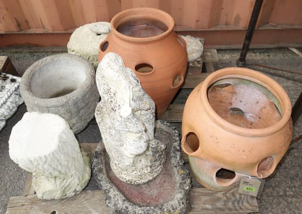 A similar pair of terracotta strawberry pots, a reconstituted figure of a lady, a reconstituted stone bird bath and a pair of circular stone planters.