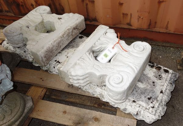 A 20th century white painted concrete bench with lions paw feet.