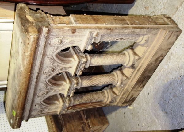 A pair of Gothic revival carved architectural elements and a quantity of carved panels (qty).