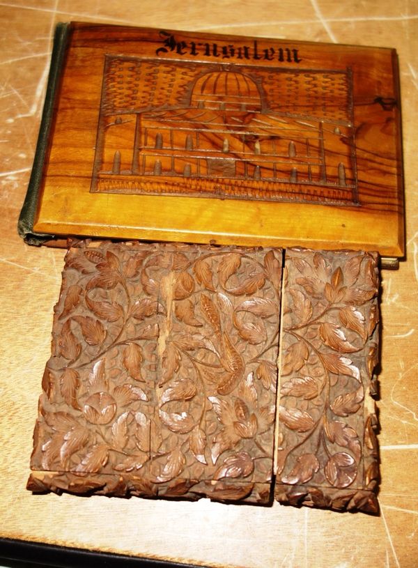 An olivewood souvenir album; Jerusalem, flowers from the Holy Land and a carved sandalwood card case, (2).