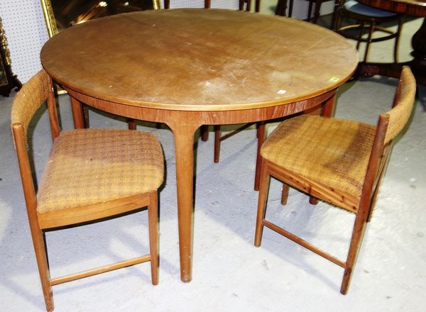A 20th century teak circular table, 122cm wide and four chairs,(5).