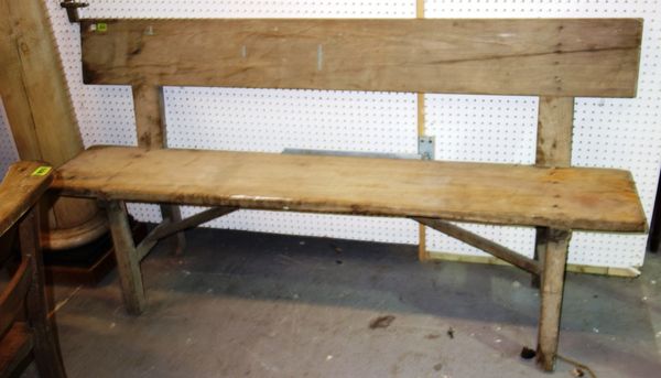 A 20th century pine bench, 176cm wide.
