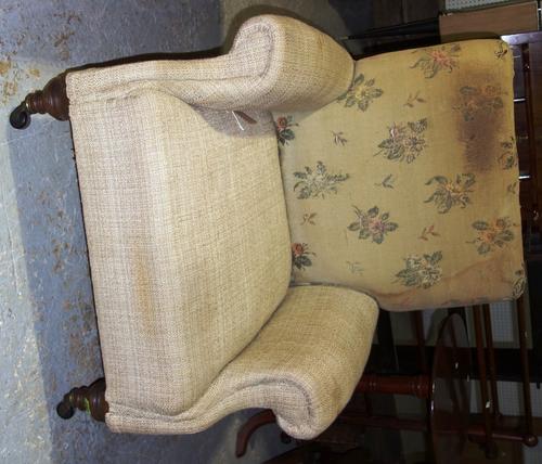 An early 20th century Howard & Sons style armchair.