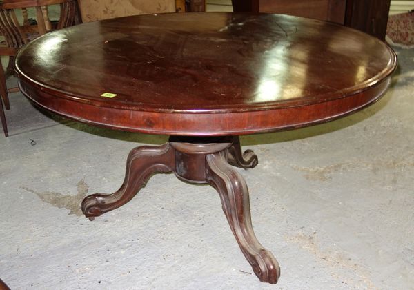 A Victorian mahogany circular breakfast table on carved tripartite base, 118cm diameter.