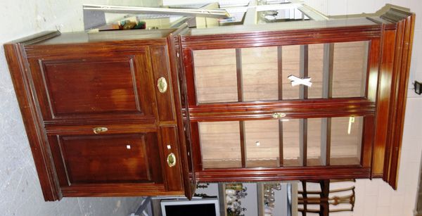 A Victorian mahogany library bookcase, the glazed upper section above a pair of cupboards, 187cm wide.