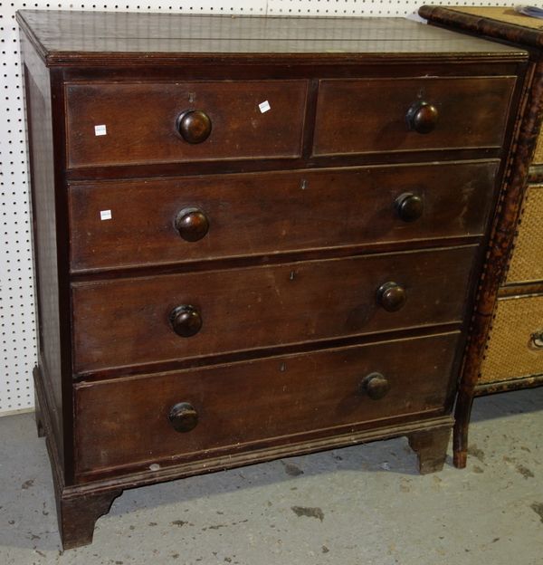 An early 19th century oak chest with two short and three long drawers, on bracket feet 97cms.