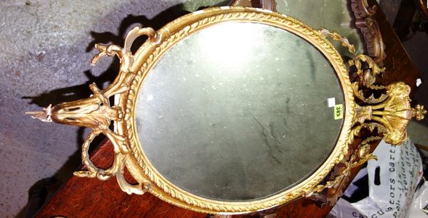 An oval gilt gesso wall mirror, 42 cm x 91 cm (a.f.).
