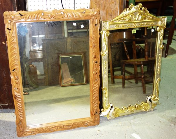 A cream and gilt rectangular wall mirror with serpentine decoration and a carved beech mirror, (2).