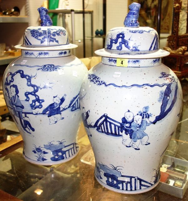 A pair of large blue and white Chinese baluster vases decorated with figures. (2)