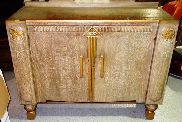 A 20th century limed oak side cabinet, 120.5cm wide.