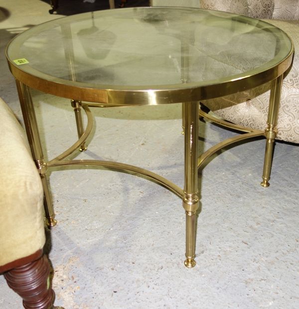 A 20th century brass and glass circular coffee table, 61.5cm wide.