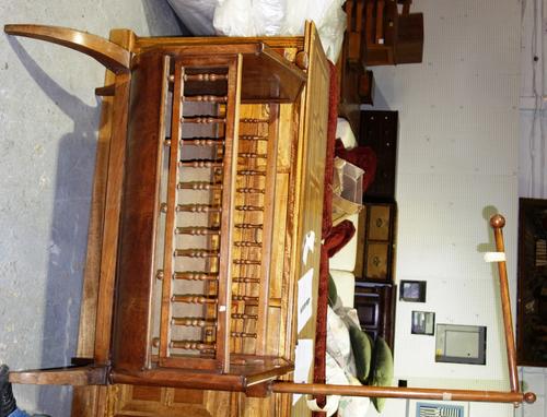 A 19th century green painted and simulated single bed frame, comprising; a pair of ends, side rails and base and a French cherry wood basket cradle (a