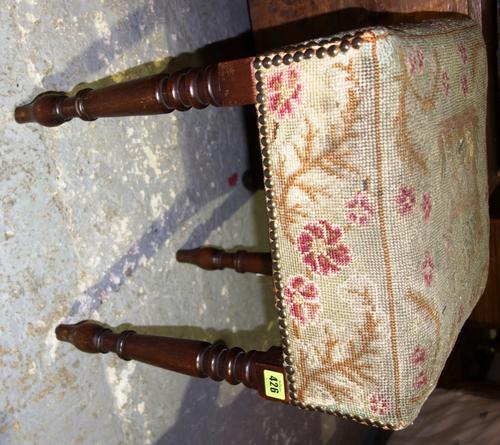 A 19th century mahogany square footstool on turned legs and needlework seat, 38cm wide.
