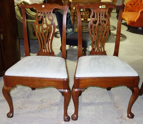 A pair of 18th century mahogany framed dining chairs, with pierced splat and straight front seat, on cabriole supports, (2).