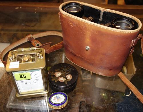 A group of collectables, including a brass cased carriage clock, binoculars, a gilt and enamel box and sundry. (qty)