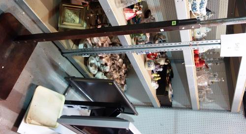 A floor standing height measure with slab elm base.