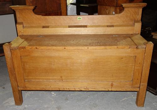 A 20th century oak lift top settle hall bench, 103cm wide.