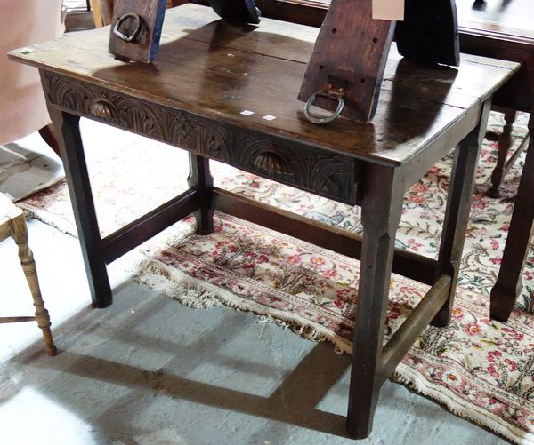 An 18th century and later oak rectangular single drawer side table.
