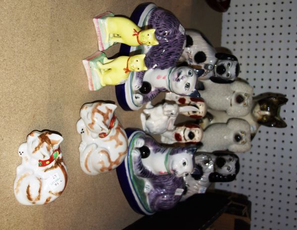 A quantity of ceramic animals, including Staffordshire spaniels, Oriental cats and sundry. (qty)