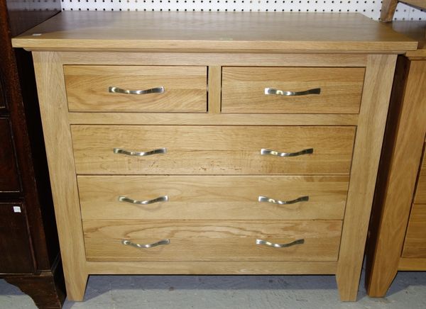 A 20th century oak chest of two short and three long graduated drawers, 92cm wide.