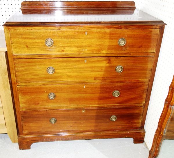 A 20th century walnut chest of four long graduated drawers, 91cm wide.