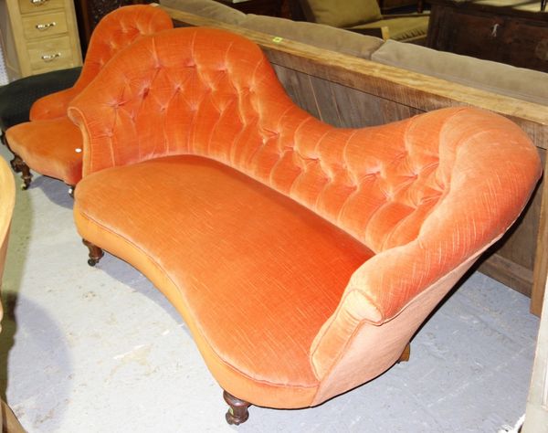 A 19th century orange upholstered double hump back sofa and a similar button seated chair. (2)