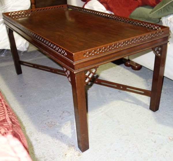 A 20th century rectangular mahogany coffee table with galleried fret cut top, 108cm wide.