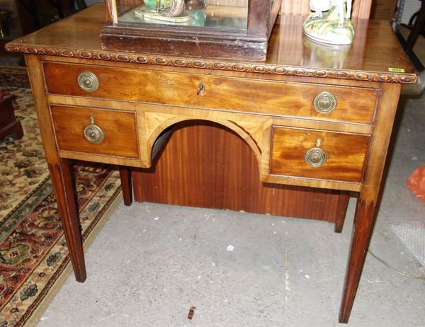 A 19th century mahogany and inlaid kneehole dressing table, 91 cm wide.
