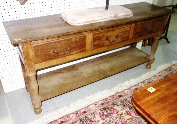 An early 20th century continental oak dresser base with three frieze drawers and undertier, 163cm wide.